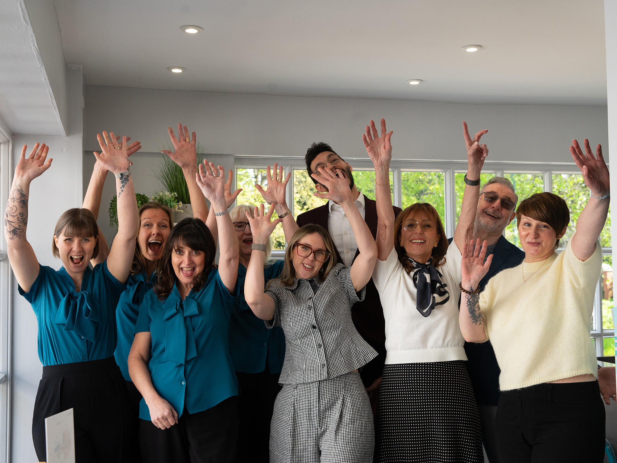 Celebrating hearing care A team of person centred hearing care professionals celebrating